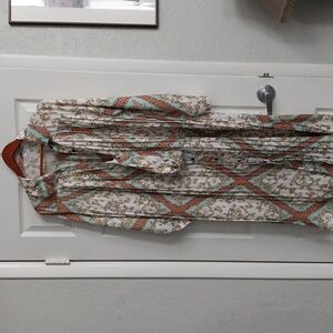 A pleated button down dress.  This FARROW silkey dress is one size fits all.